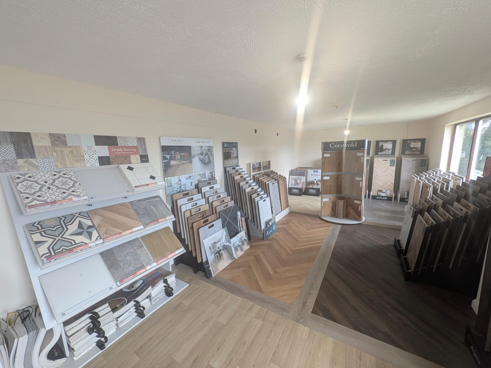Luxury vinyl tile and laminate displays in the Craig McLean Flooring showroom